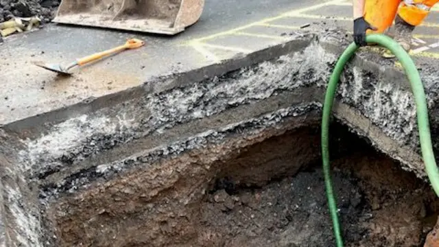 Hole in road