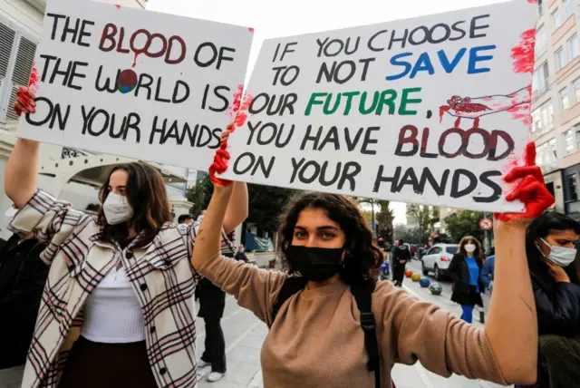 Activists march with striking placards in Istanbul, Turkey.