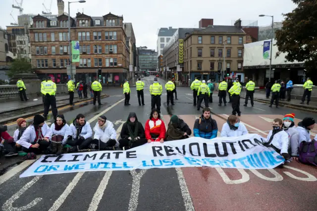 Scientist Rebellion activists chain themselves together