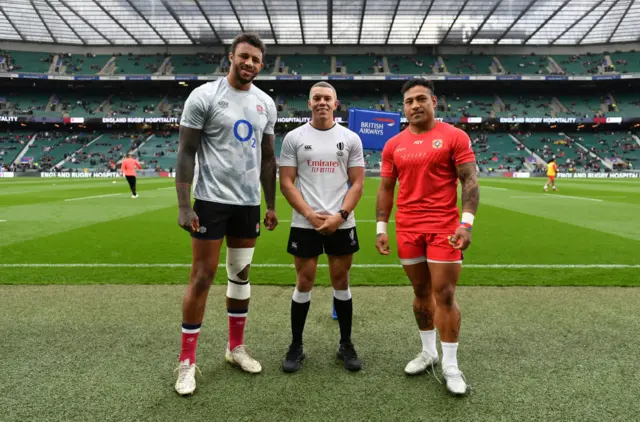 Courtney Lawes and S Takulua with referee Craig Evans