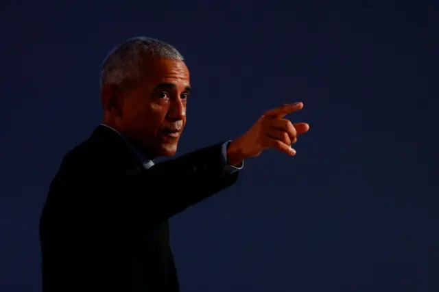 U.S. former President Barack Obama delivers a speech during the UN Climate Change Conference