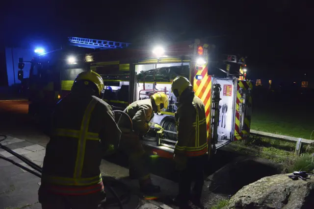 Firefighters working at night