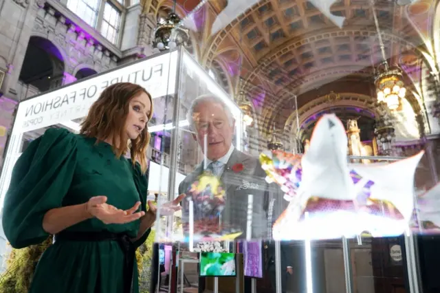 Britain"s Prince Charles speaks with fashion designer Stella McCartney as he views a fashion installation by the designer,