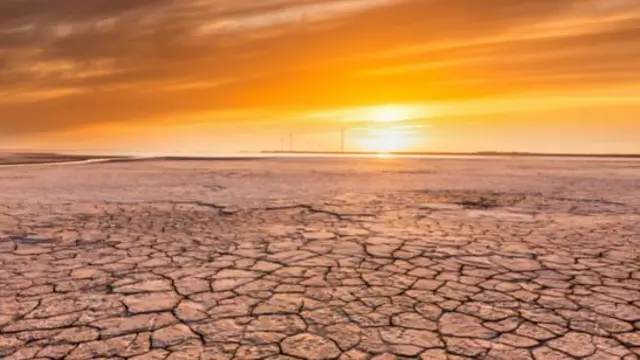 Sunset over an oil field