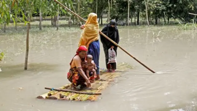 Women paddleboard in Bangladesh amid flooding