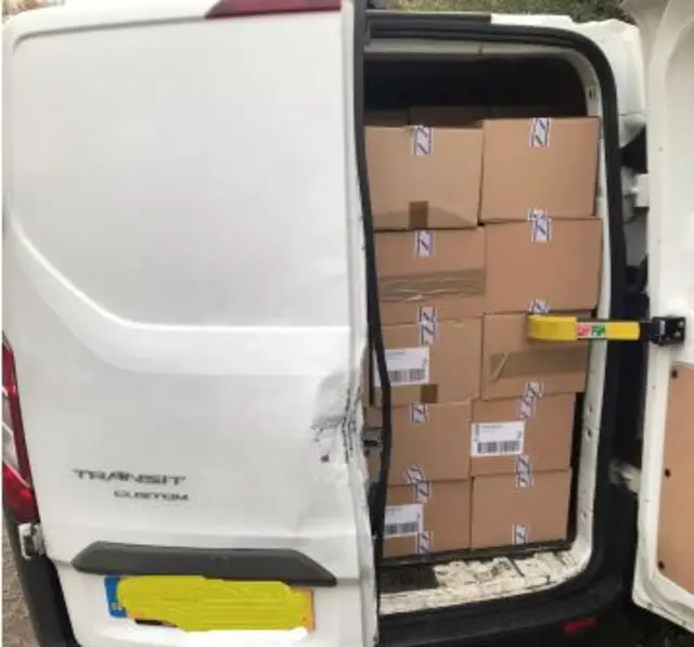 Van filled with boxes of tobacco