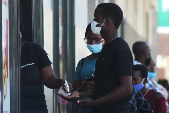 eople wear mask to protect themselves from Omicron variant of coronavirus in Harare, Zimbabwe on November 28, 2021