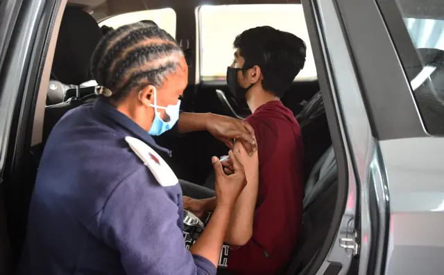 People receive a dose of Covid-19 vaccines following the detection of the new omicron variant of the coronavirus, at a vaccination station in Cape Town, South Africa on November 30, 2021