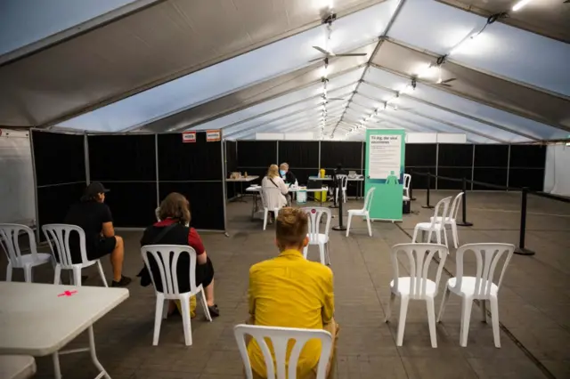 People wait for their vaccine in Denmark