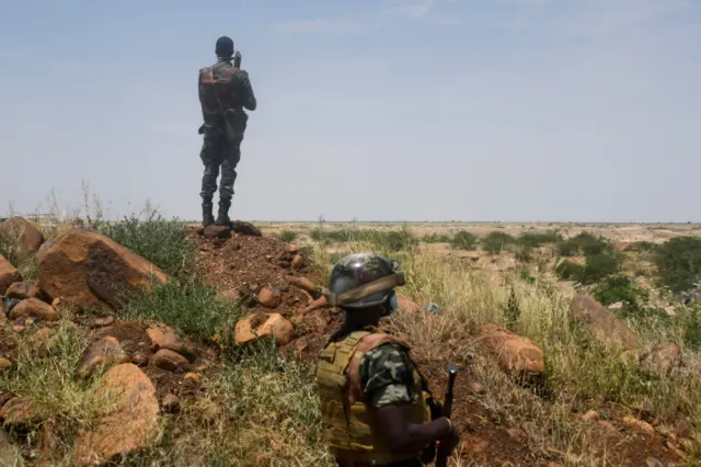 Niger's soldiers stand guard and patrol, on September 10, 2021