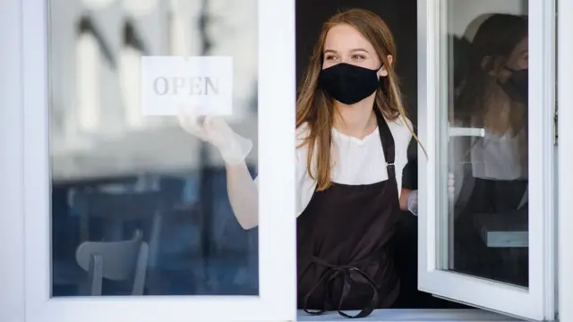Woman with opening sign