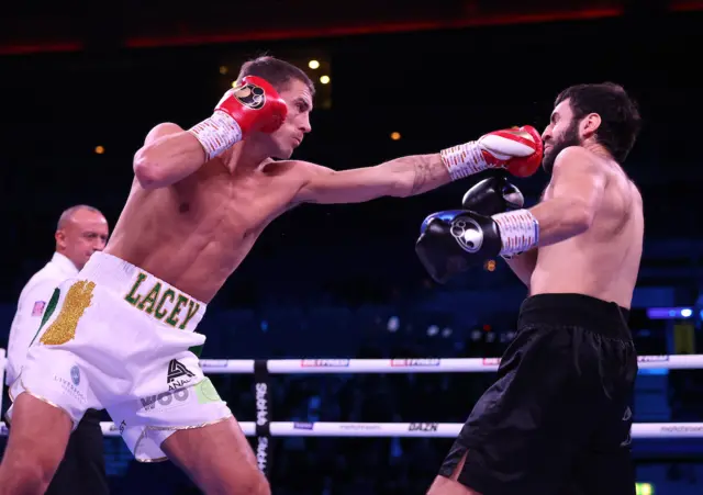 Paddy Lacey punches his opponent