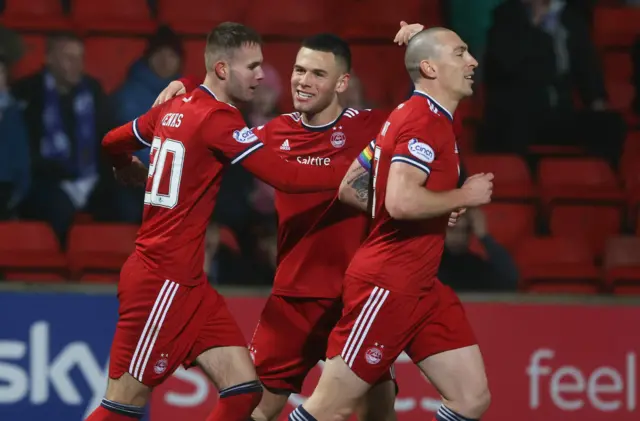 Teddy Jenks (left) scores his second goal for Aberdeen