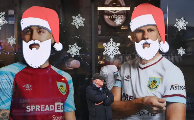 Burnley pictures of players with a white santa beard stencilled over them