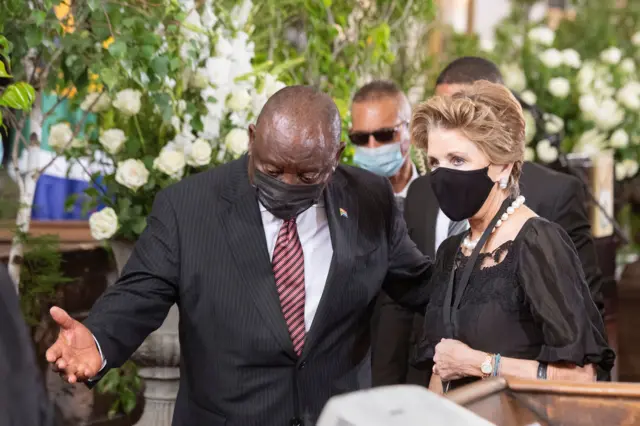 South African President Cyril Ramaphosa (L) is seen with Elita Georgiades (R), wife of former South African President FW de Klerk, during de Klerk's state memorial service at the Groote Kerk church in Cape Town on December 12, 2021