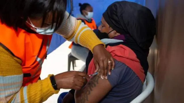 A woman in South Africa receives a Covid vaccine