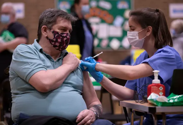 A man being vaccinated