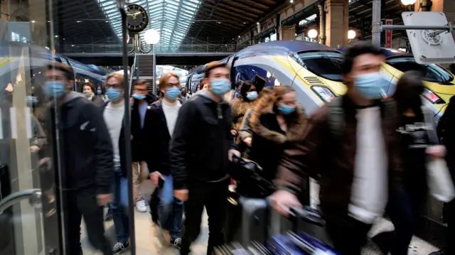 People walking down a Eurostar platform