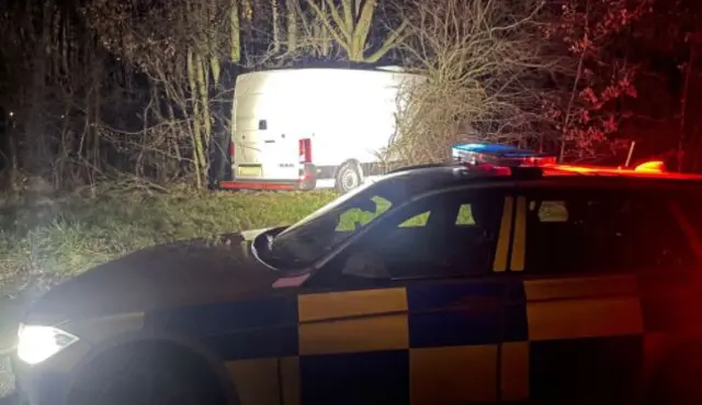 Police car and dumped van