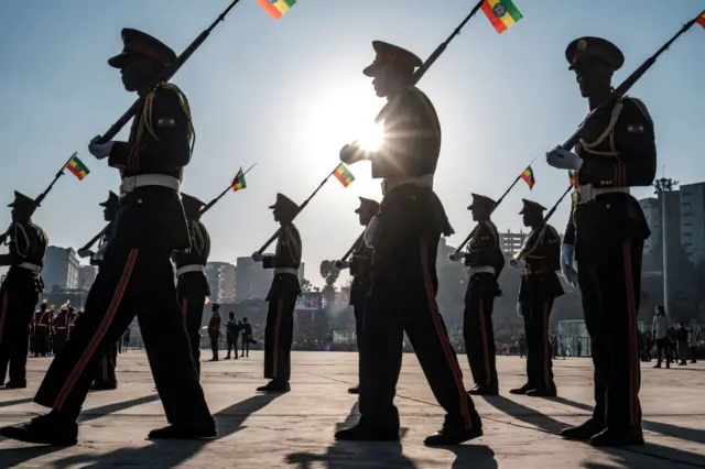 Members of a military music band march during a rally in Addis Ababa