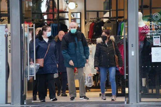 Shoppers wear face masks