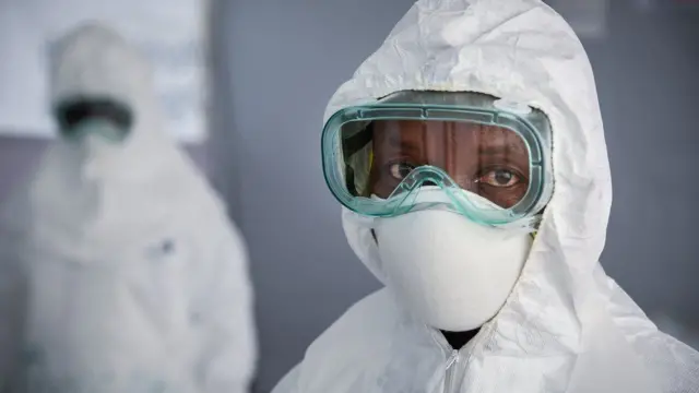 A health worker dressed in protective gear