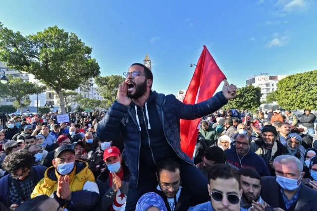 Supporters of the "Citizens Against Coup" campaign demonstrate against President Kais Saied. One man is shouting