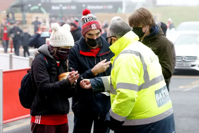 Middlesbrough fans show Covid passes