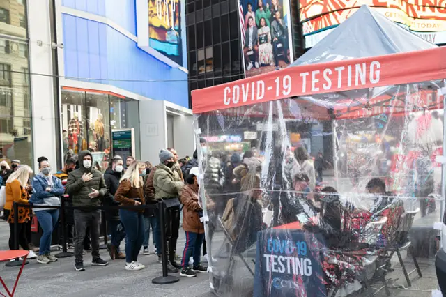 People queue up for COVID-19 nucleic acid testing at a testing facility in Times Square on December 17, 2021 in New York City.