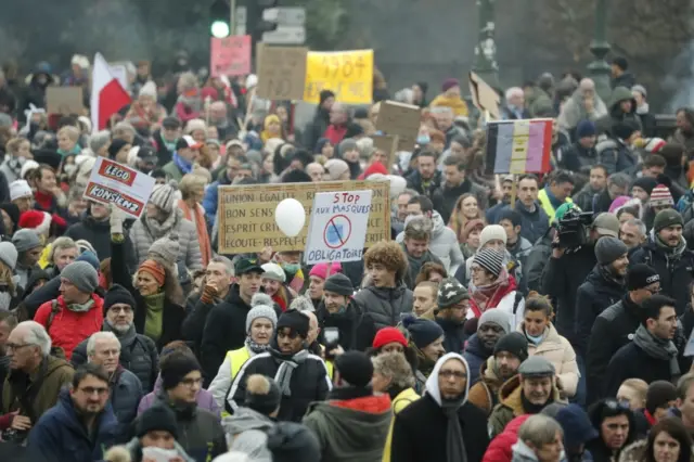 People take part in an anti-coronavirus measures protest in Brussels, Belgium, 19 December 2021