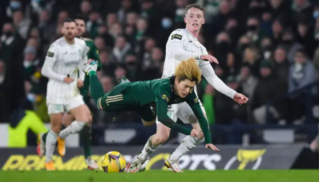 Celtic striker Kyogo Furuhashi goes down in the penalty box