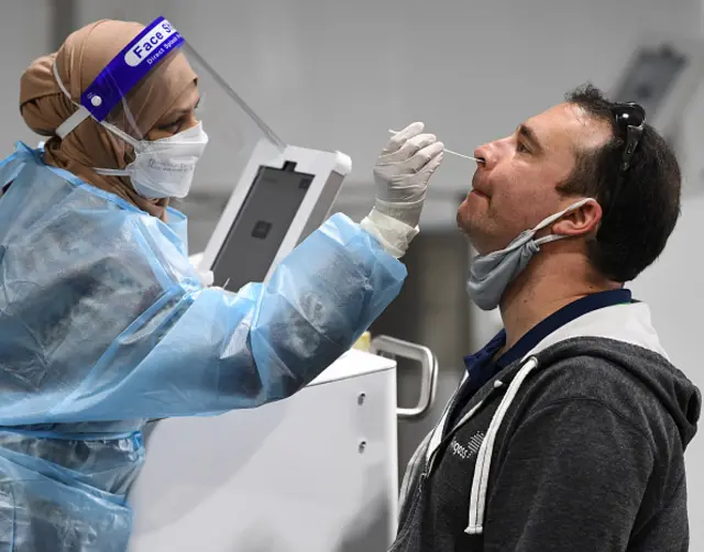 A man has a COVID-19 test at the Histopath Diagnostic Specialists pre-departure area at Sydney International Airport on November 28, 2021 in Sydney, Australia.