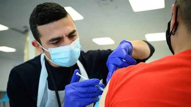 A person being vaccinated.