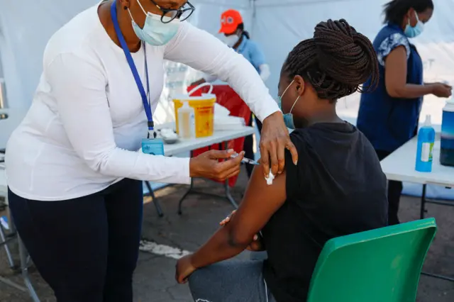 A healthcare worker administers the Johnson and Johnson vaccine