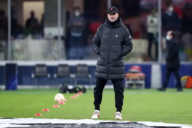 Jurgen Klopp watches his players warm-up