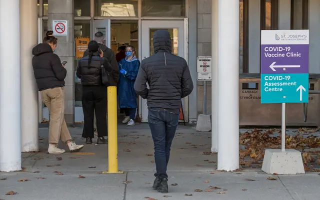 People wait for a covid-19 test in Toronto