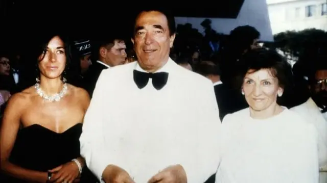 Robert Maxwell standing next to Ghislaine Maxwell and his wife Elisabeth at an event, circa 1990.