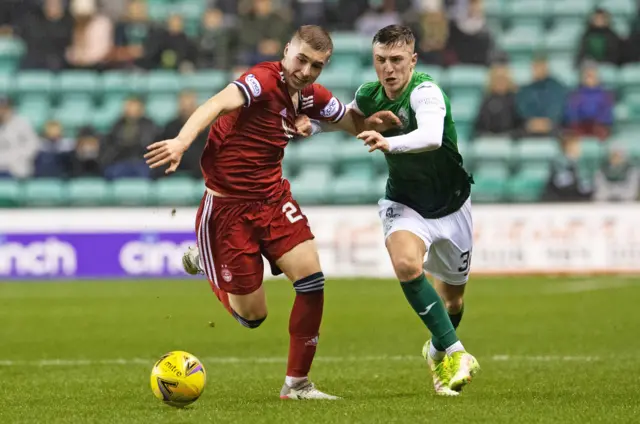 Aberdeen's Dean Campbell battles with Hibernian's Josh Campbell