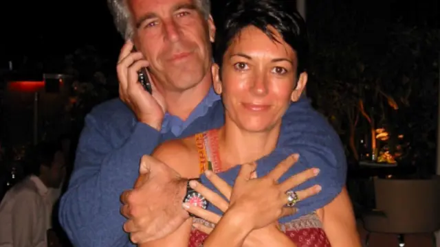 Jeffrey Epstein hugging a smiling Ghislaine Maxwell