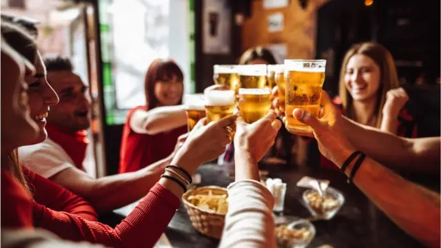 Group of people meet in a pub