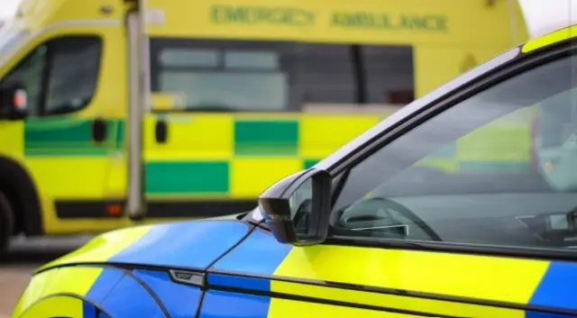 Cumbria Police vehicle and ambulance