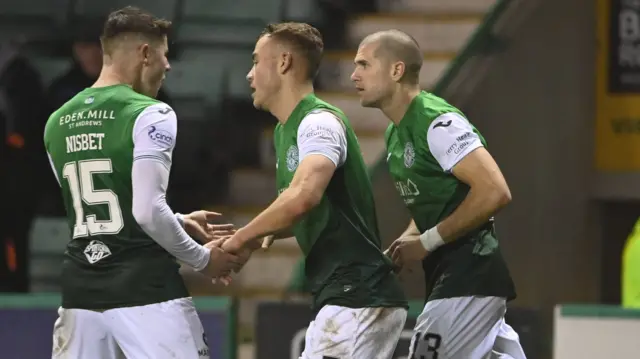 Hibernian's Ryan Porteous (centre) settled the game with a second-half header