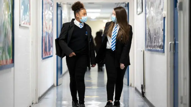 Two school pupils with masks on