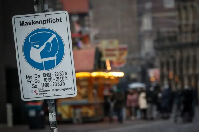 A sign in Germany indicates masks are mandatory