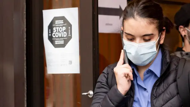 A woman wears a mask in Spain