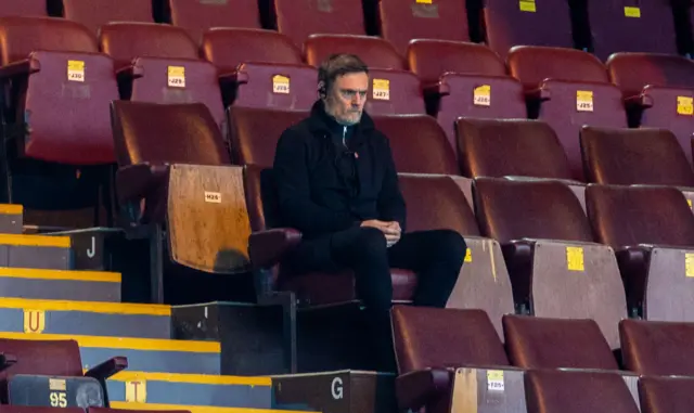 Motherwell boss Graham Alexander cut a lonely figure in the Fir Park stand