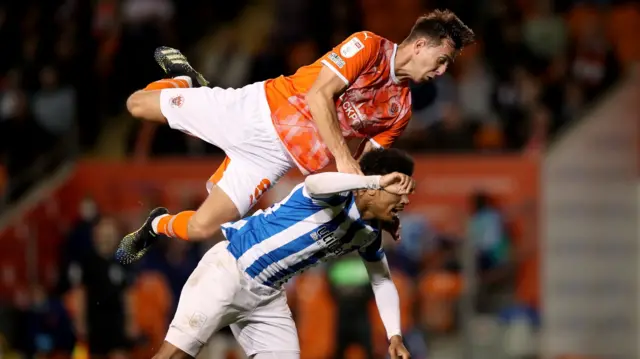 Blackpool's Ryan Wintle and Huddersfield's Josh Koroma