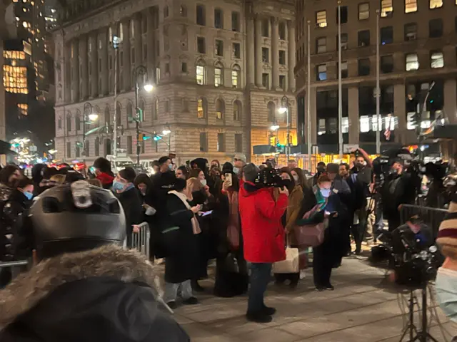 People standing outside the federal courthouse in Manhattan.