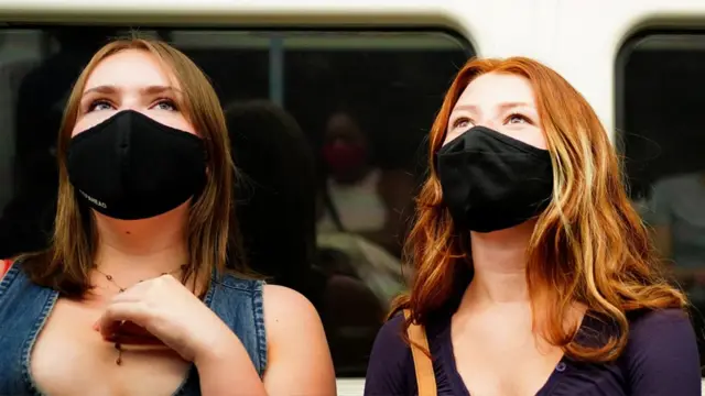 Tube passengers wearing masks