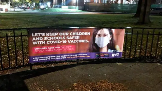 A banner promoting vaccines in children